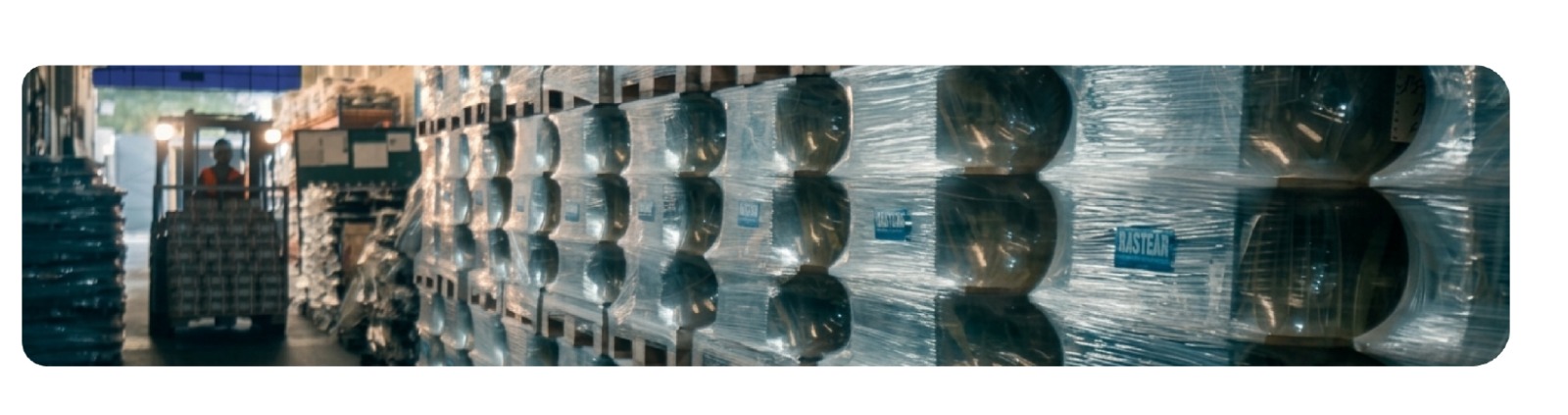 Wrapped and palletised Rastgar wheel hubs staged for despatch in the packing hall